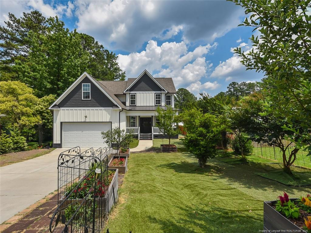 723 Lindley Drive Durham, NC 27703 - Photo 1 of 37 a front view of a house with garden