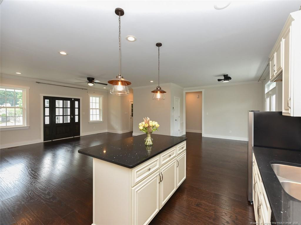 723 Lindley Drive Durham, NC 27703 - Photo 15 of 37 a kitchen with counter top space and wooden floor