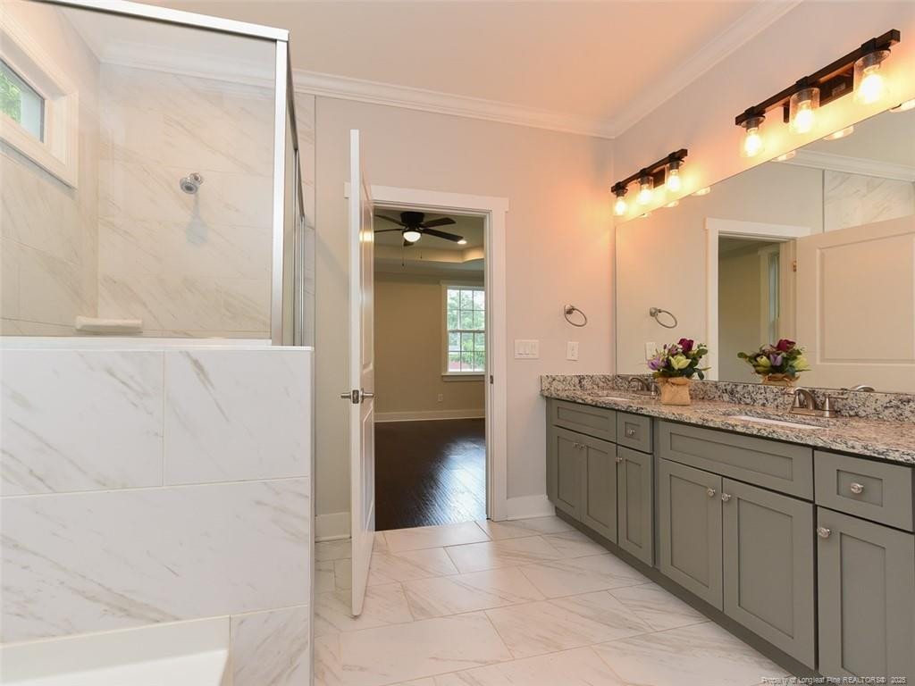 723 Lindley Drive Durham, NC 27703 - Photo 19 of 37 a bathroom with a granite countertop sink mirror and shower