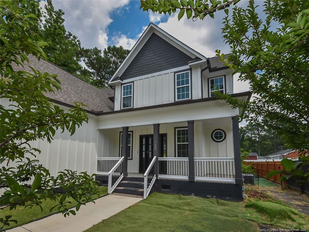 723 Lindley Drive Durham, NC 27703 - Photo 3 of 37 a view of a house with a yard plants and large tree