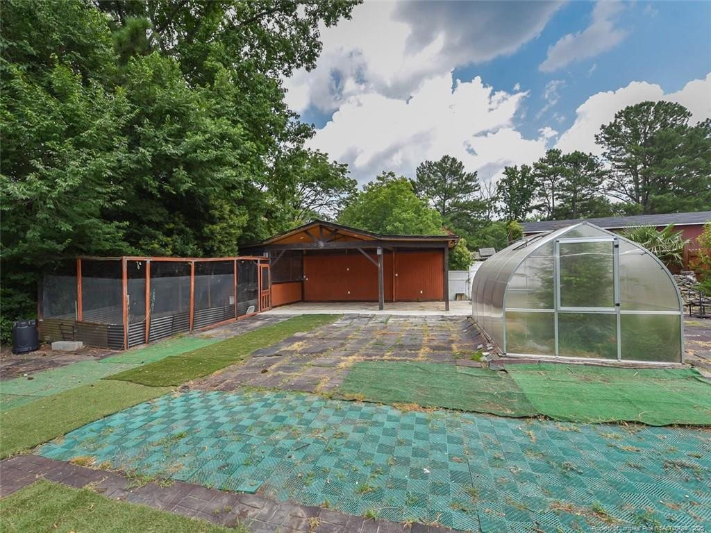 723 Lindley Drive Durham, NC 27703 - Photo 32 of 37 a backyard of a house with lots of green space