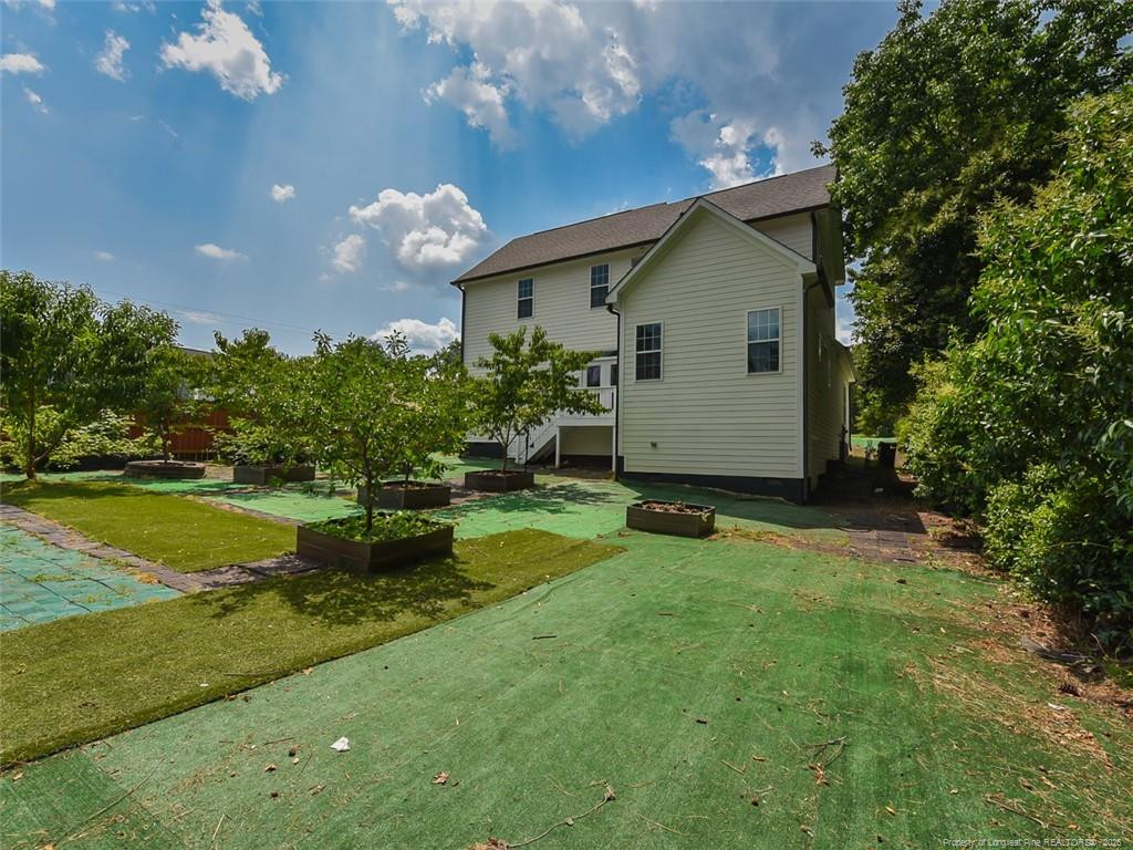 723 Lindley Drive Durham, NC 27703 - Photo 37 of 37 a view of a house with backyard and garden