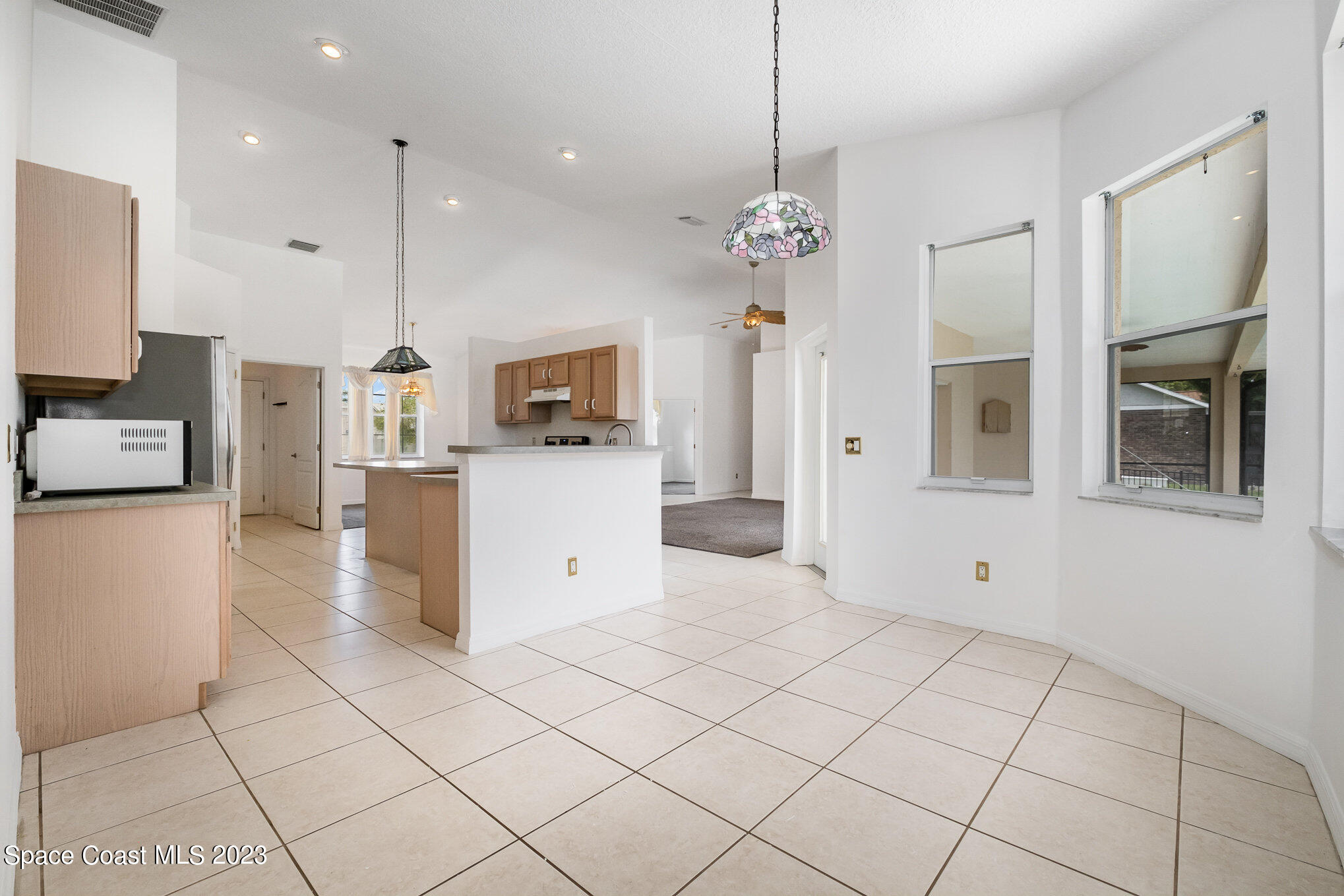 128 Palm Circle Melbourne, FL 32940 - Photo 11 of 30 a view of a kitchen with electric appliances