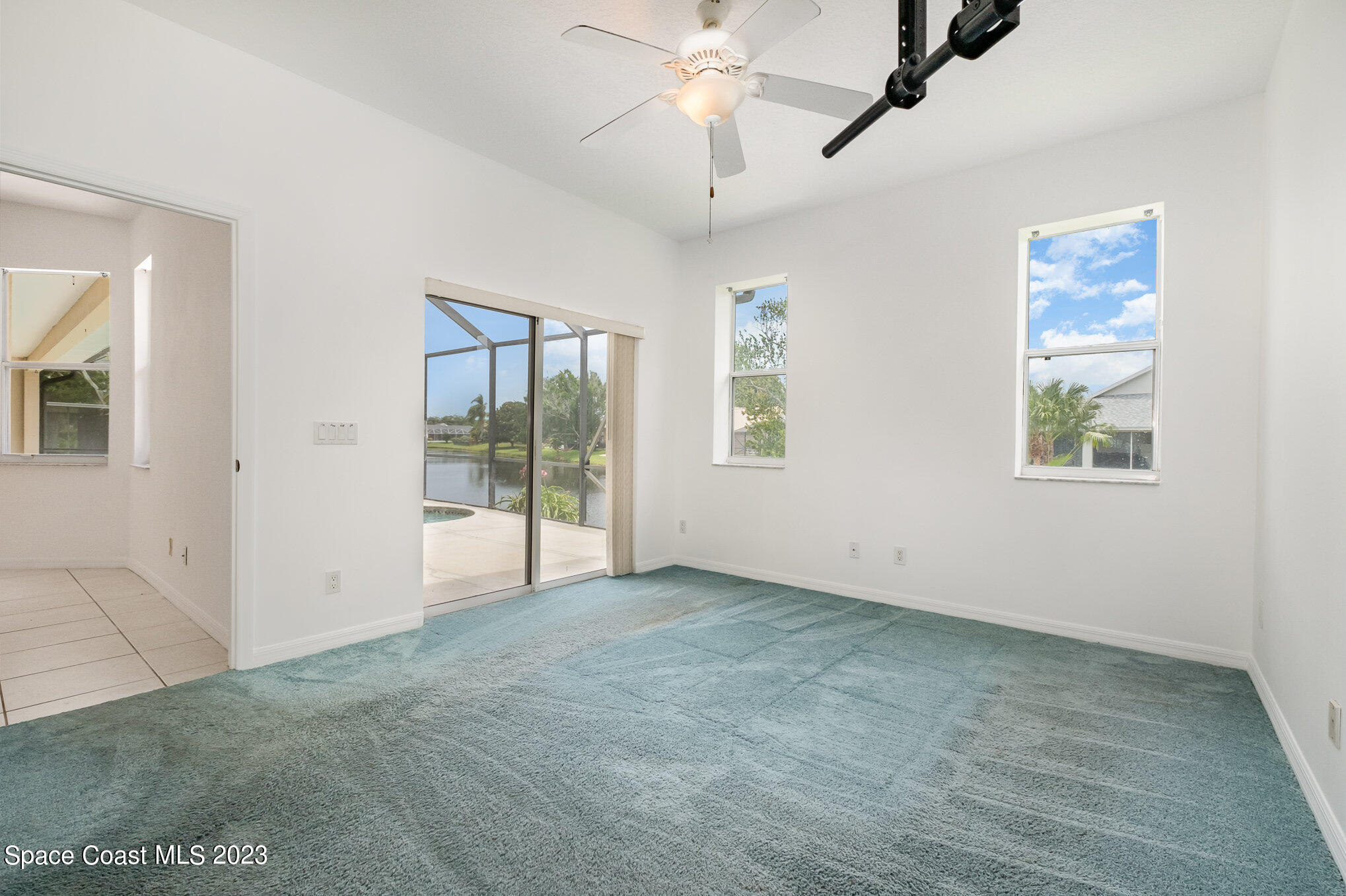 128 Palm Circle Melbourne, FL 32940 - Photo 16 of 30 a view of an empty room with a window