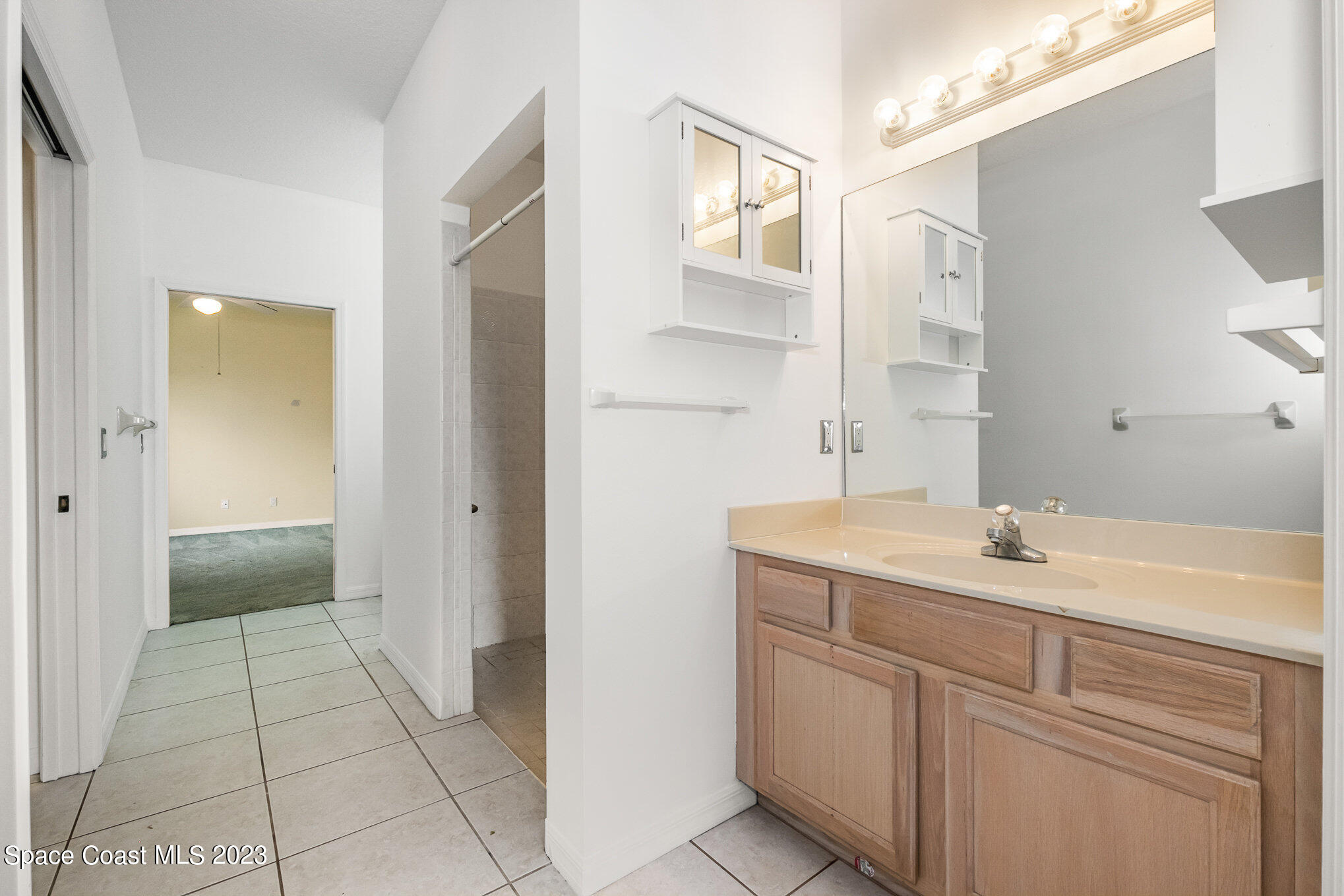 128 Palm Circle Melbourne, FL 32940 - Photo 17 of 30 a bathroom with a sink and a mirror