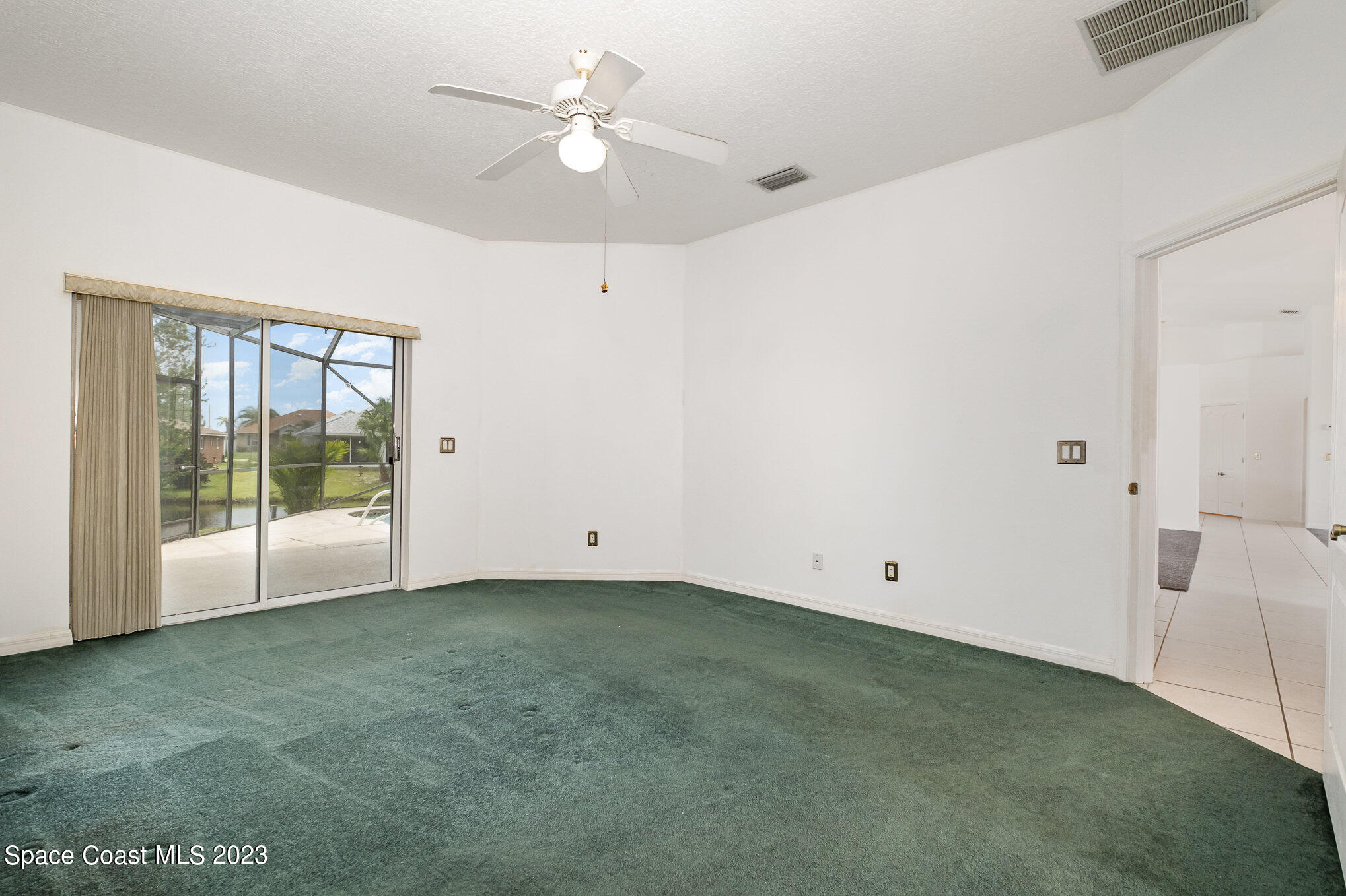 128 Palm Circle Melbourne, FL 32940 - Photo 19 of 30 a view of an empty room with a window