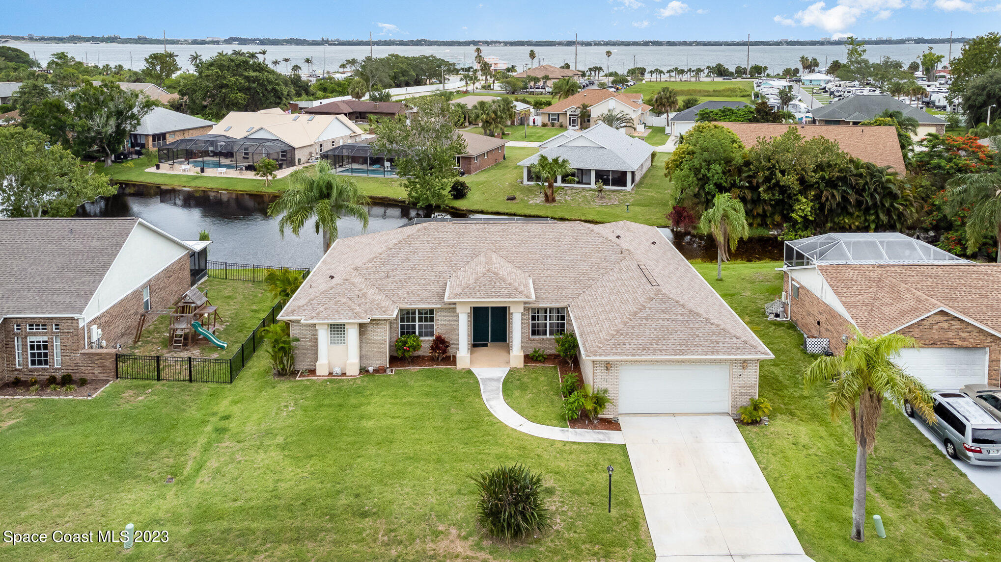 128 Palm Circle Melbourne, FL 32940 - Photo 2 of 30 an aerial view of a house with a yard