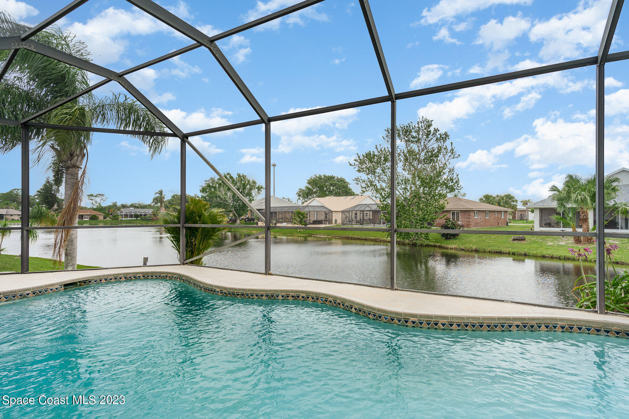 128 Palm Circle Melbourne, FL 32940 - Photo 29 of 30 a view of a lake from a window