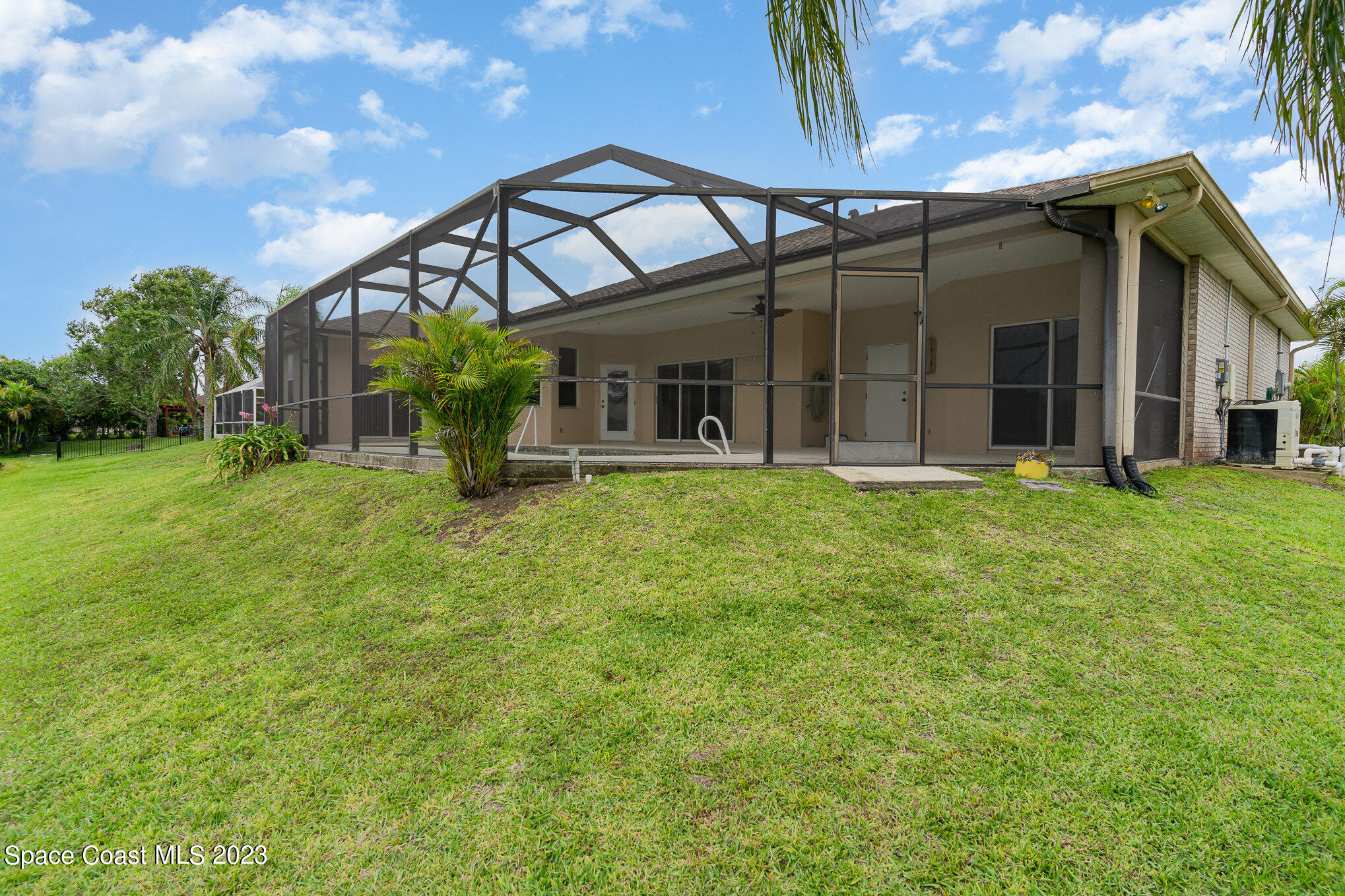 128 Palm Circle Melbourne, FL 32940 - Photo 30 of 30 a view of a house with a yard and sitting area