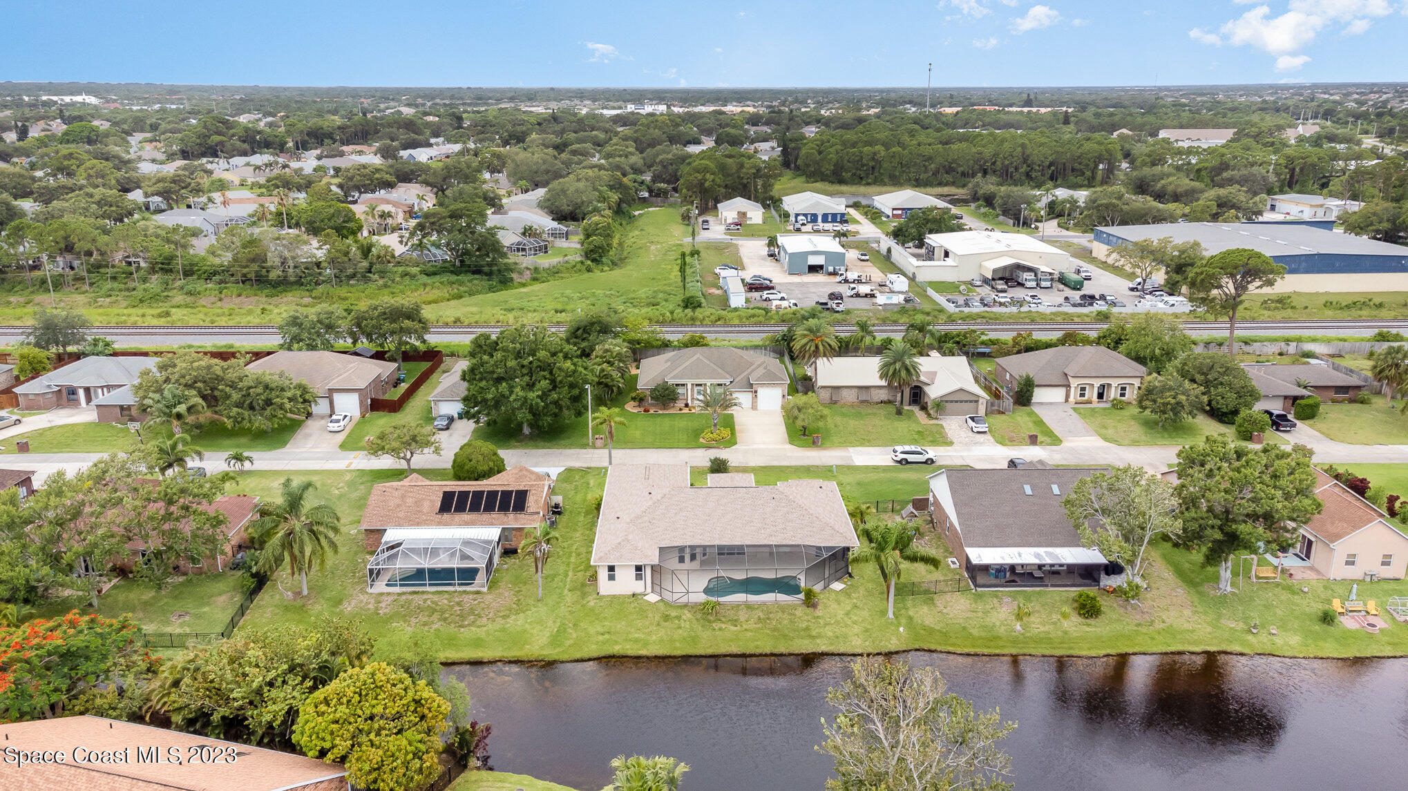 128 Palm Circle Melbourne, FL 32940 - Photo 6 of 30 an aerial view of residential houses with outdoor space and swimming pool