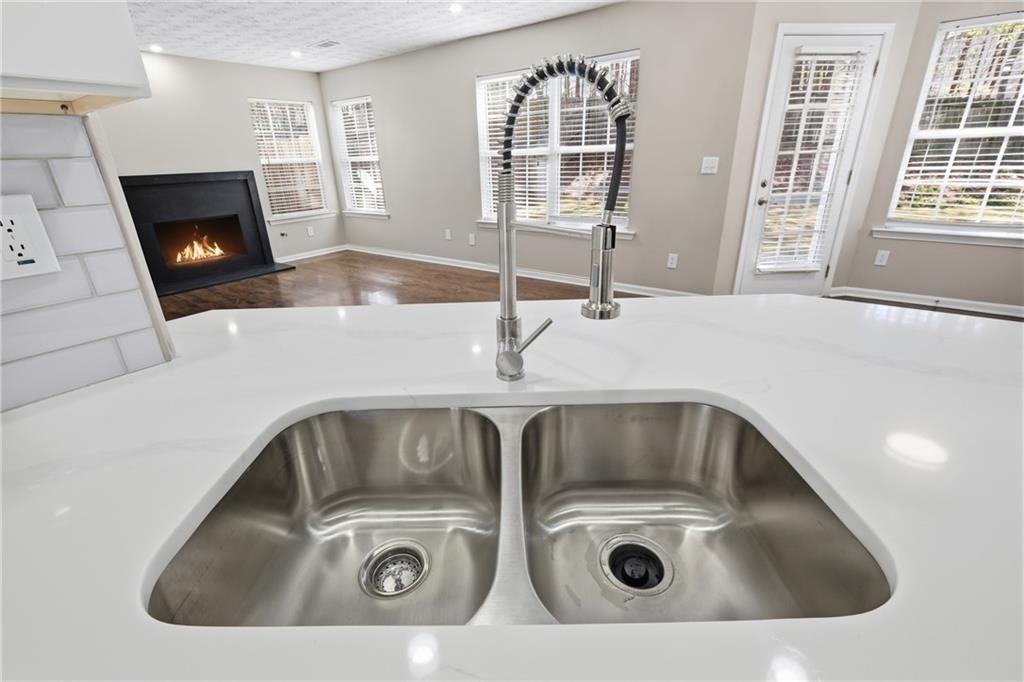 3570 Bogan Mill Road Northeast Buford, GA 30519 - Photo 7 of 31 a close view of utility and sink