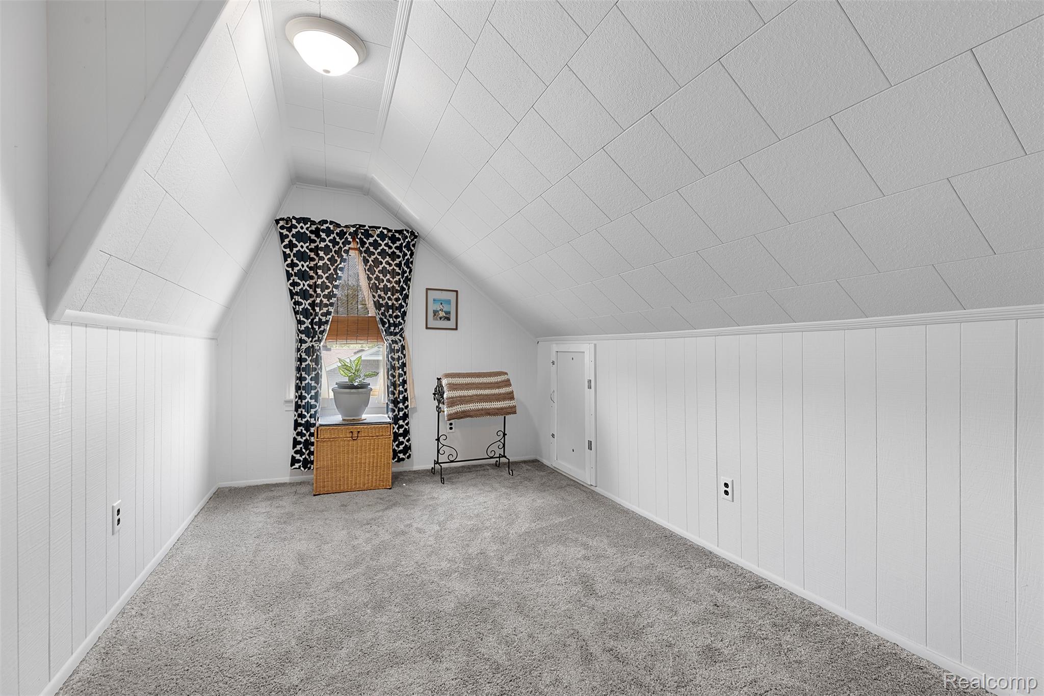 22827 Meridian Road Grosse Ile, MI 48138 - Photo 33 of 36 Bonus room with wood walls and carpet