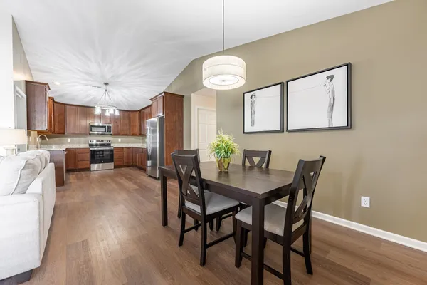 a view of a dining room with furniture window and wooden floor