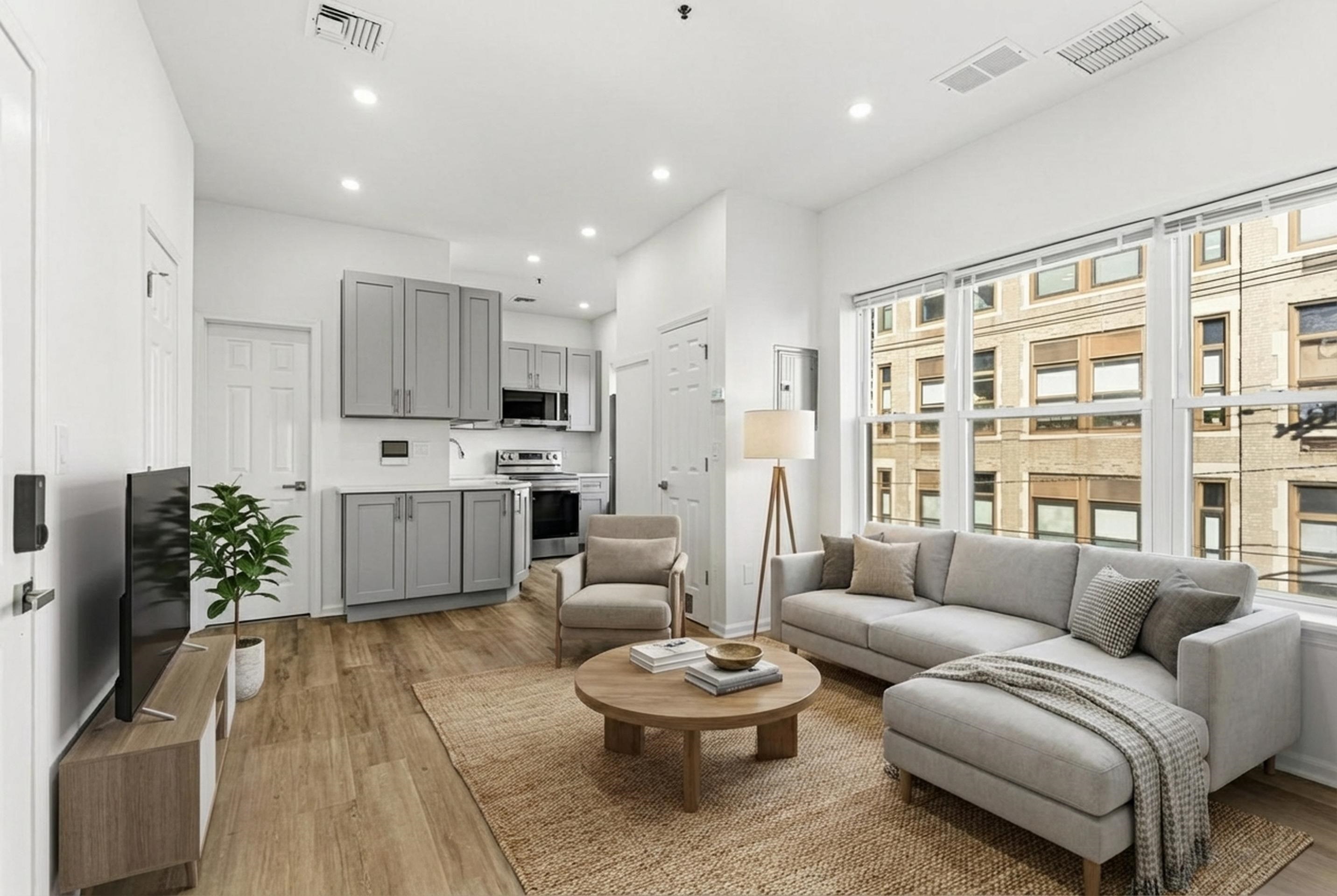 a living room with furniture and a large window
