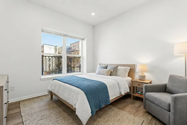 a bed room with a bed and a couch