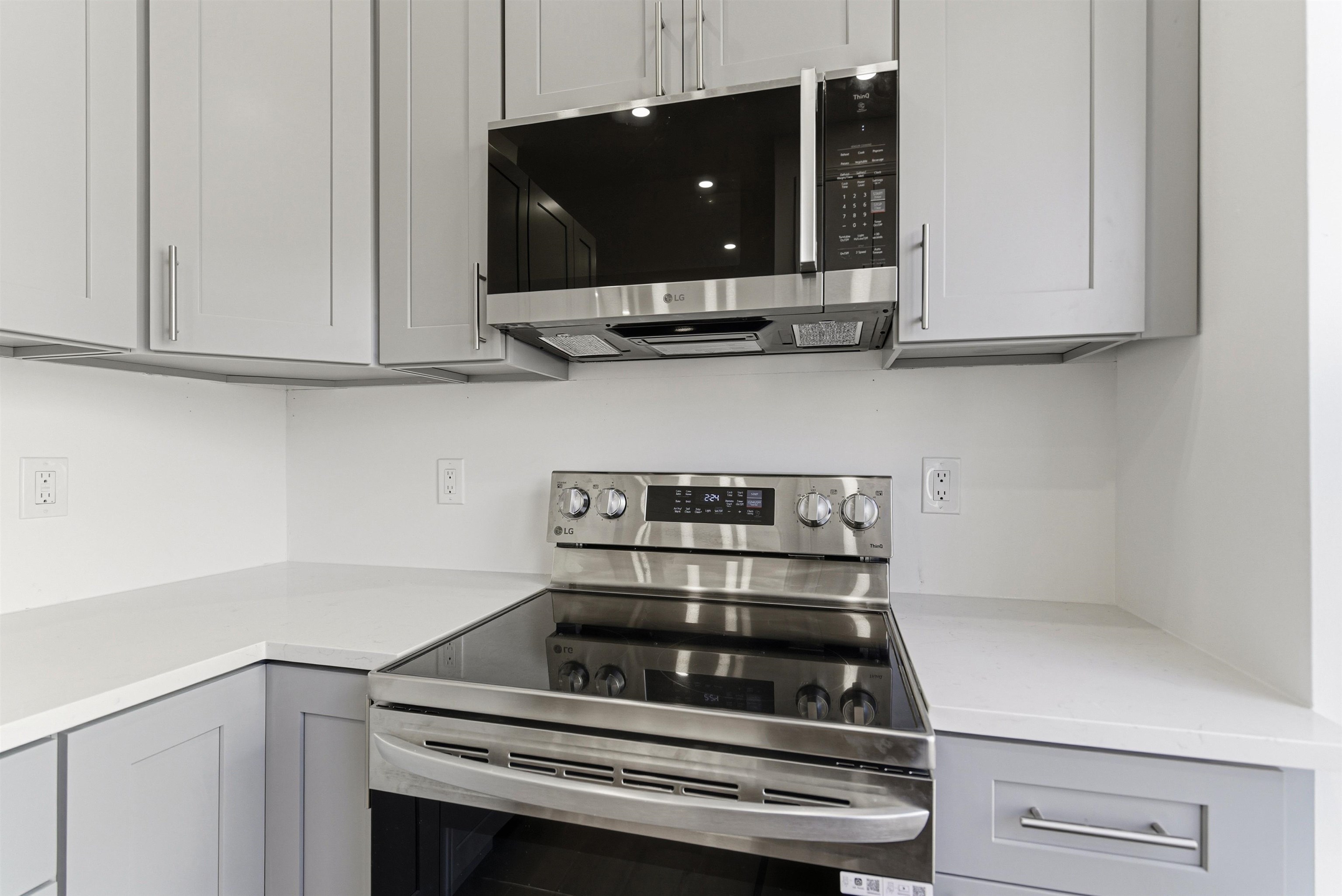 419 5th Street, Unit C Hoboken, NJ 07030 - Photo 4 of 16 a kitchen with a stove and a microwave