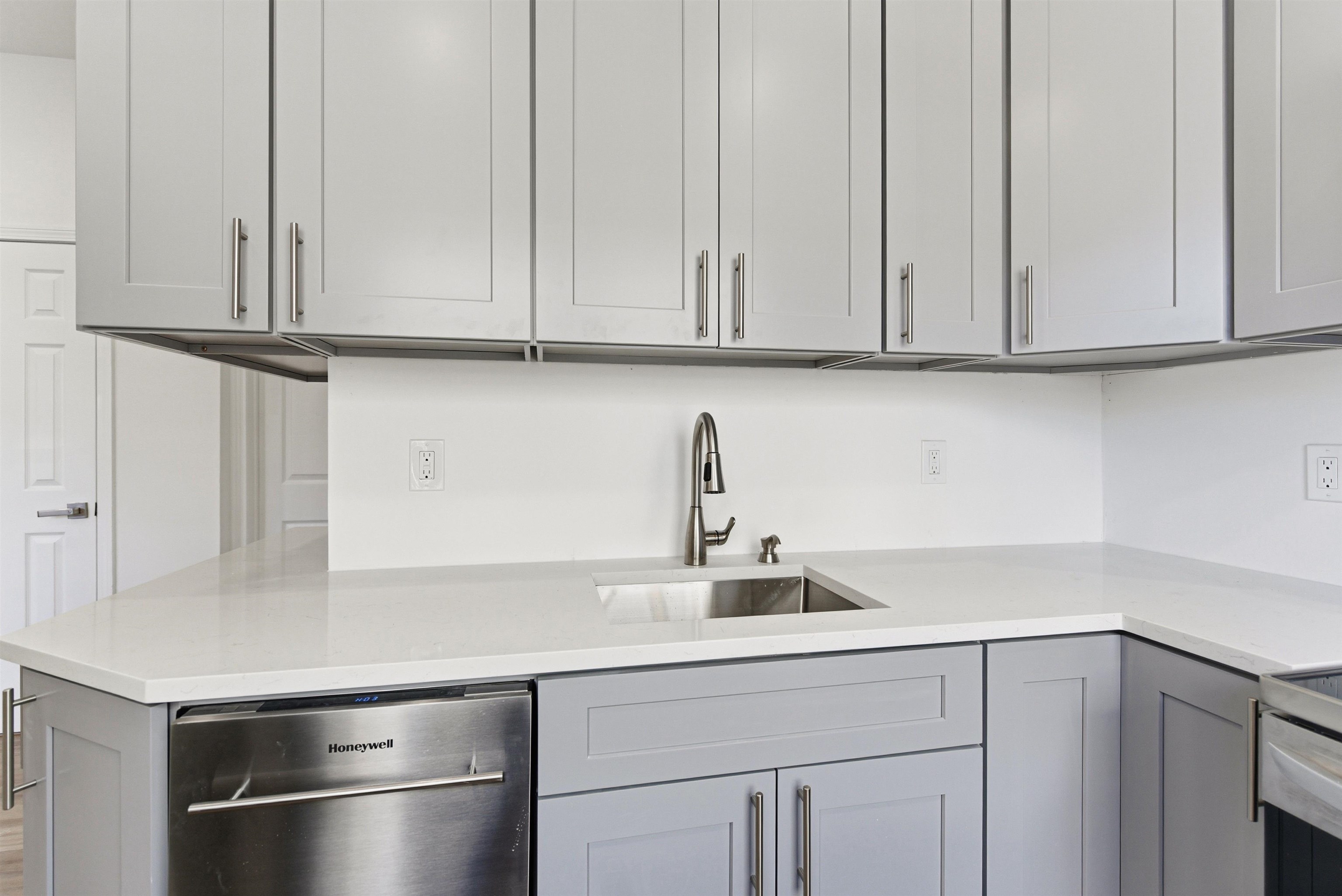 419 5th Street, Unit C Hoboken, NJ 07030 - Photo 5 of 16 a kitchen with stainless steel appliances granite countertop white cabinets and a sink