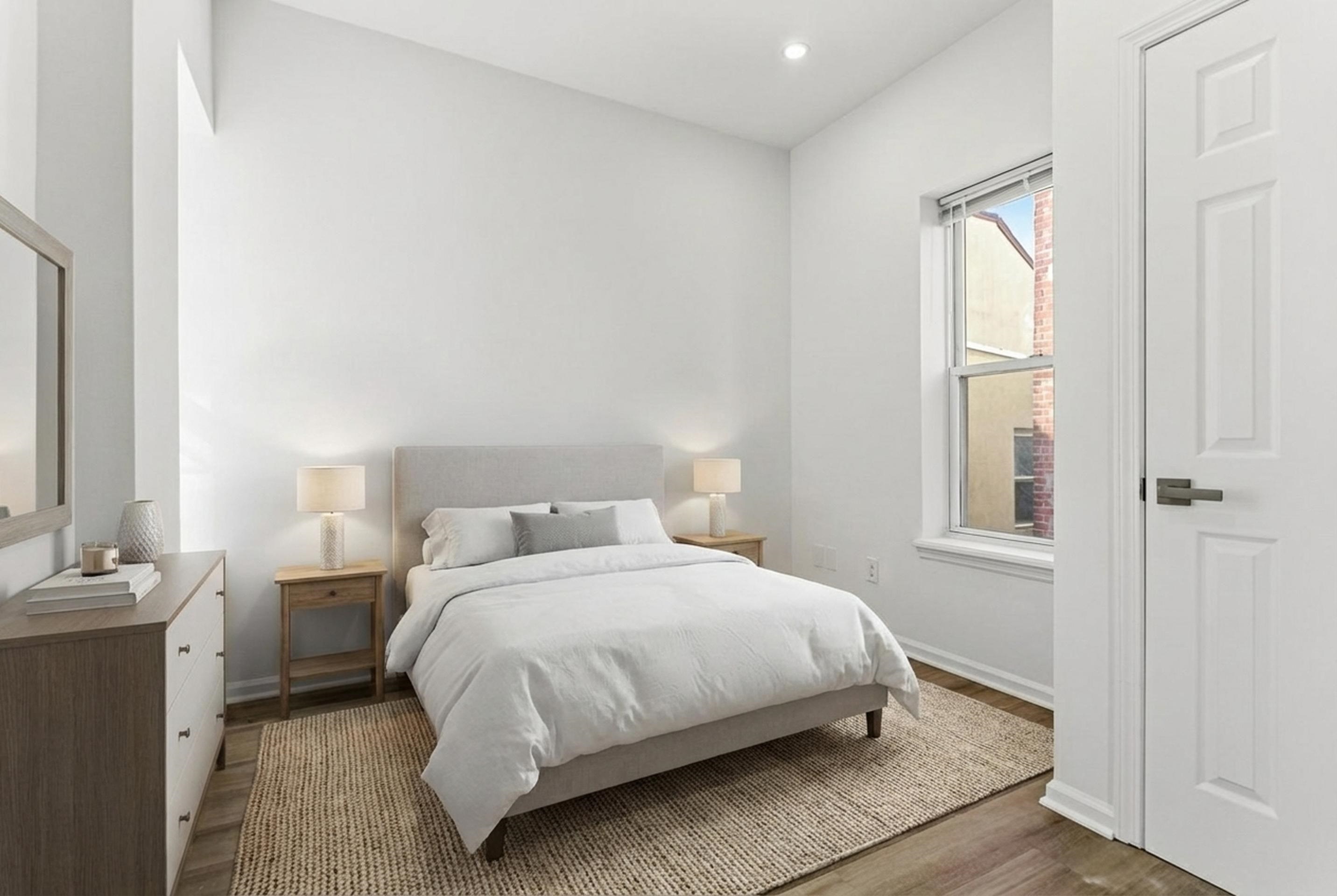 419 5th Street, Unit C Hoboken, NJ 07030 - Photo 8 of 16 a bedroom with a bed and window