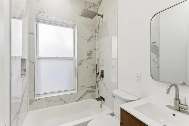 a bathroom with a sink and a bathtub
