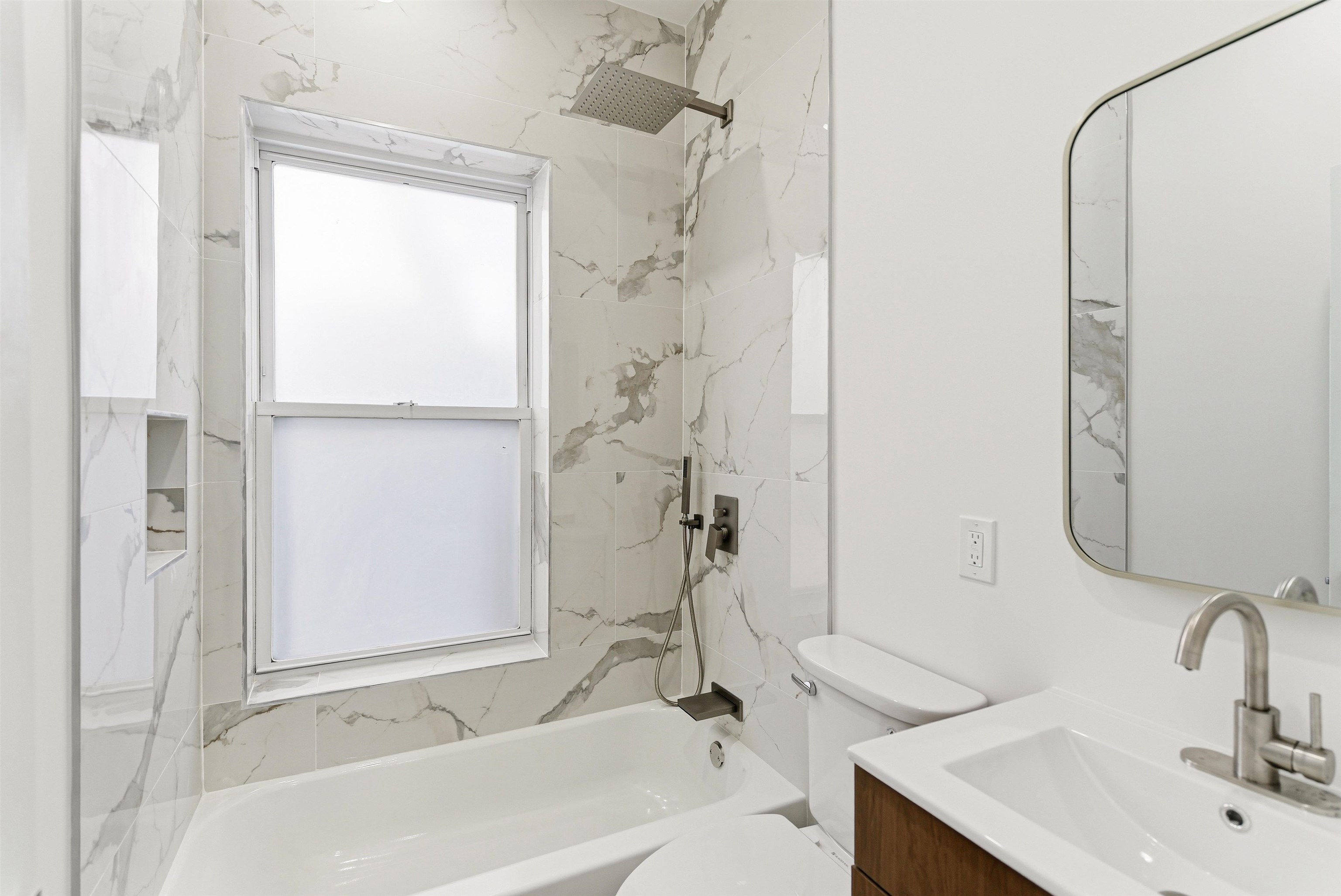 419 5th Street, Unit C Hoboken, NJ 07030 - Photo 9 of 16 a bathroom with a sink and a bathtub