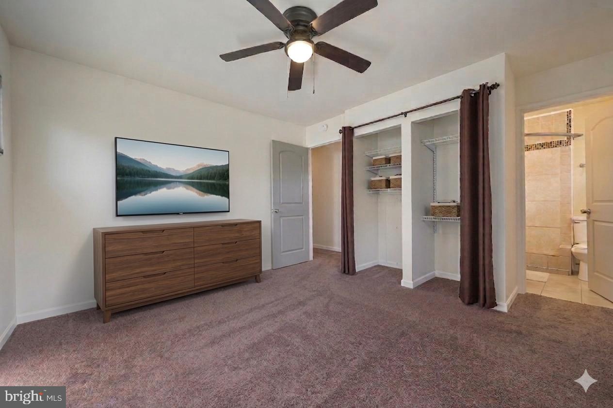 1431 Joshua Clayton Road Dover, DE 19904 - Photo 18 of 31 a room with furniture and a flat screen tv