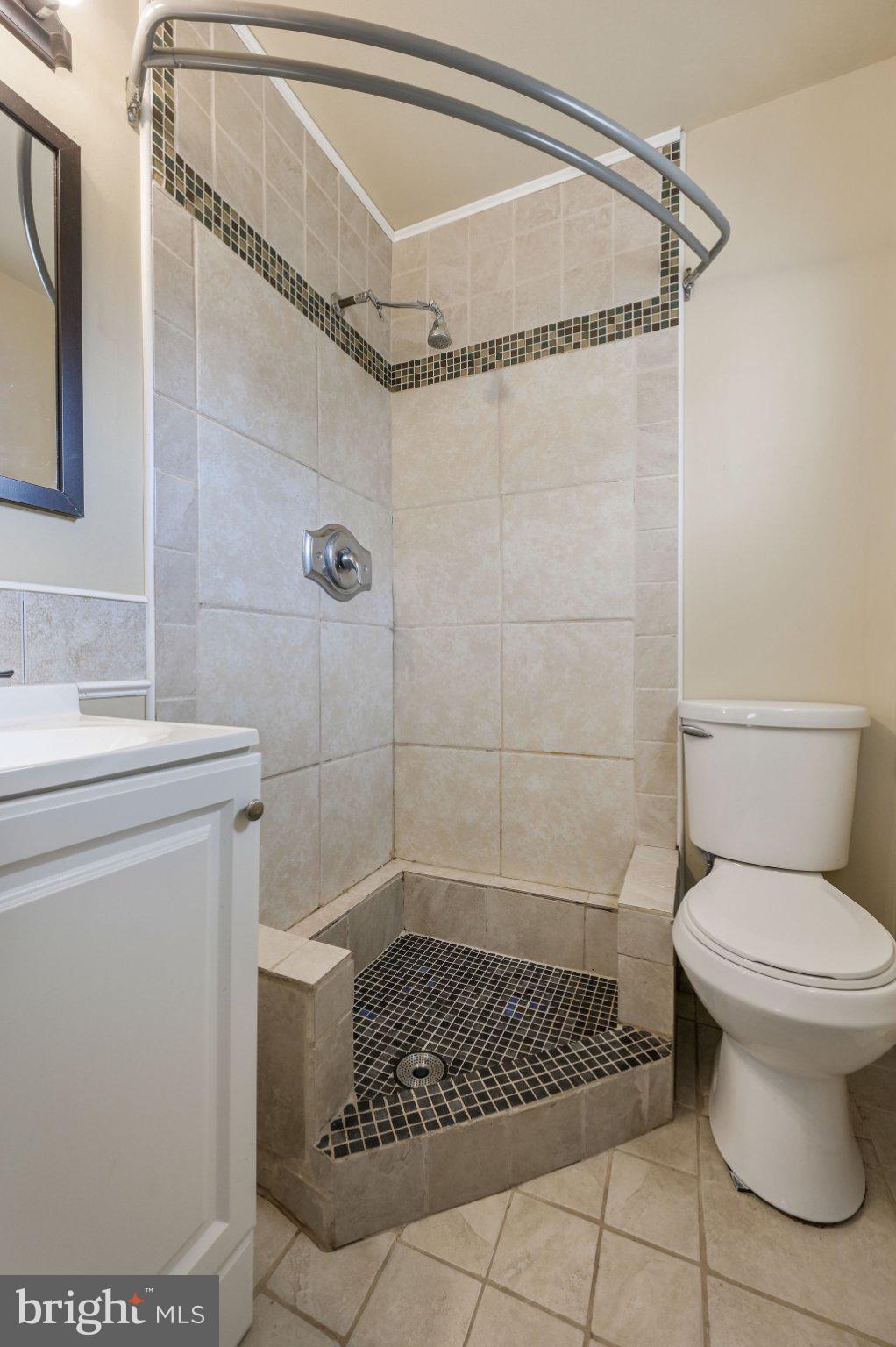 1431 Joshua Clayton Road Dover, DE 19904 - Photo 19 of 31 a bathroom with a toilet and a shower