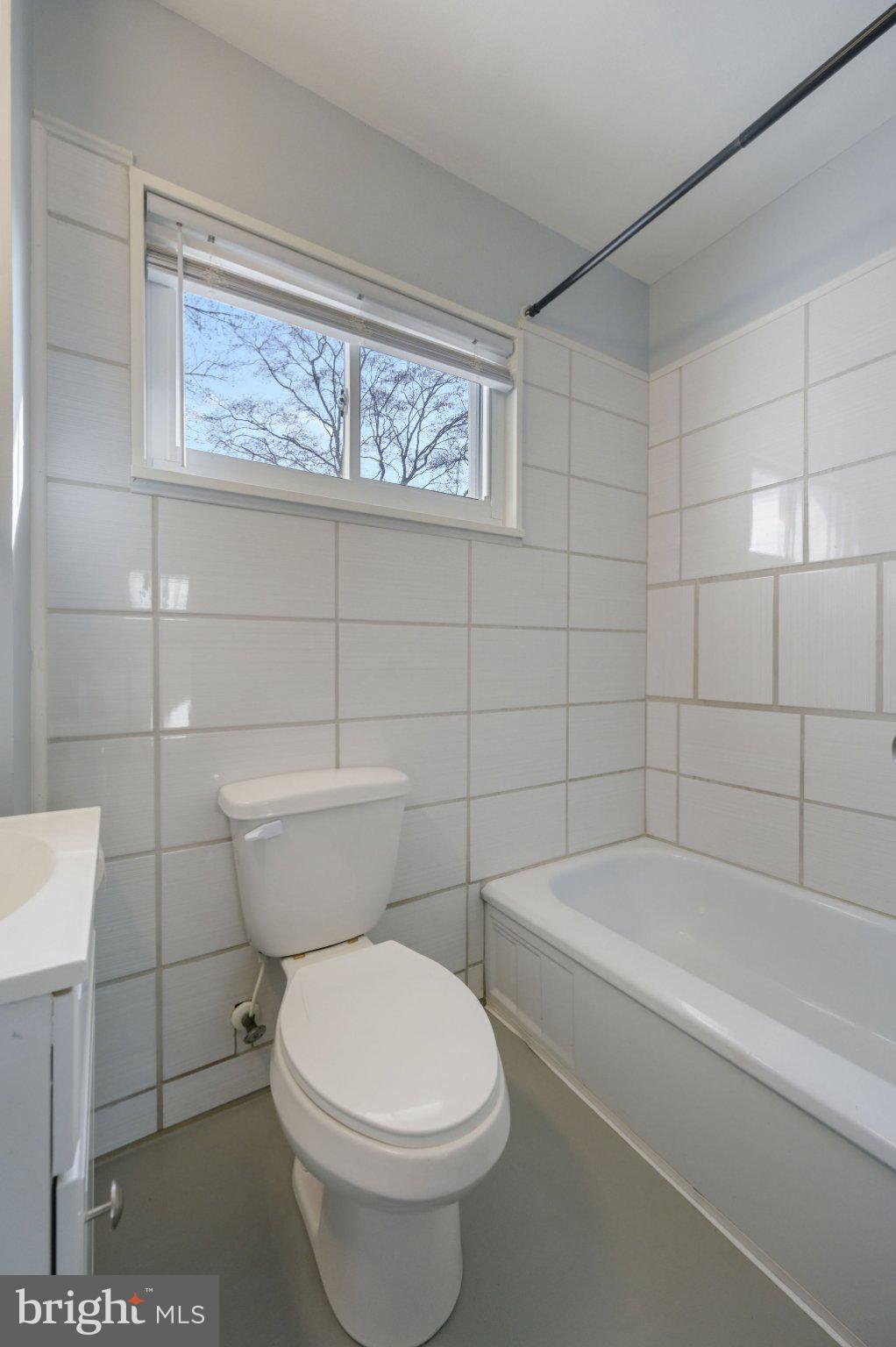1431 Joshua Clayton Road Dover, DE 19904 - Photo 26 of 31 a bathroom with a toilet and bathtub