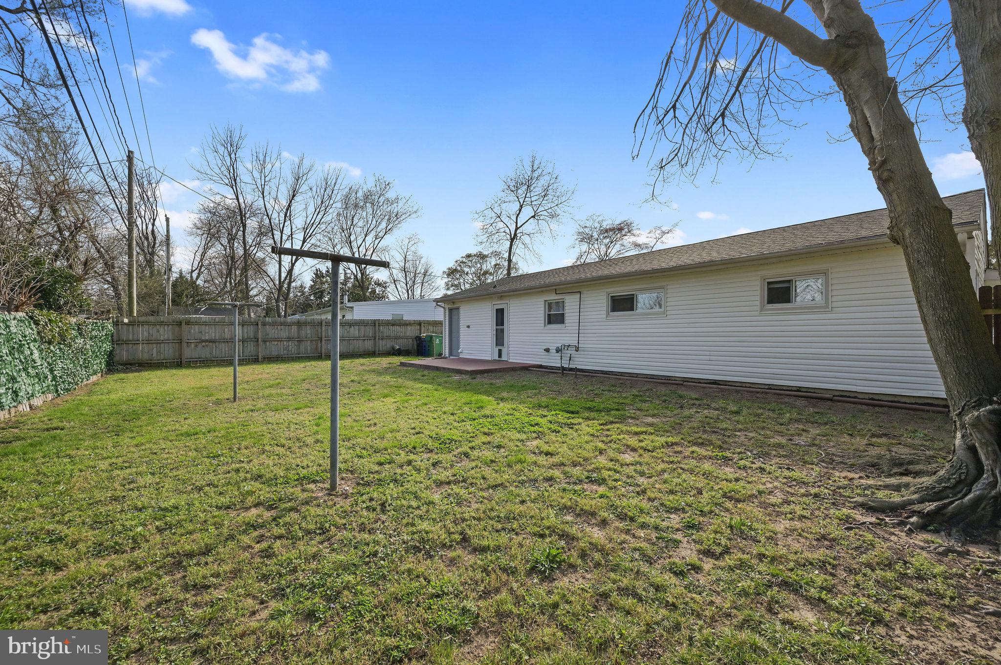1431 Joshua Clayton Road Dover, DE 19904 - Photo 28 of 31 a backyard of a house with lots of green space