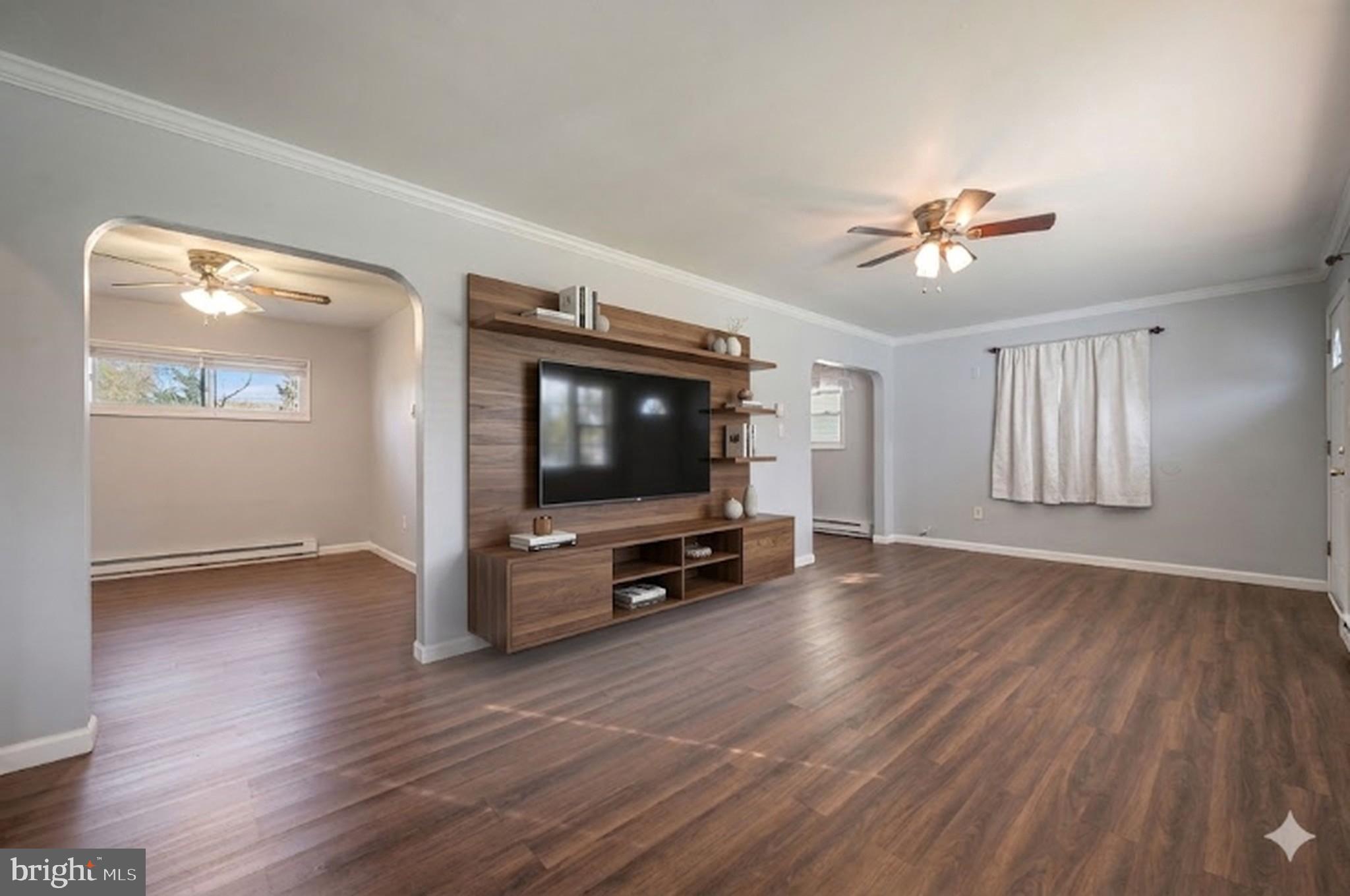 1431 Joshua Clayton Road Dover, DE 19904 - Photo 5 of 31 a living room with furniture and a flat screen tv