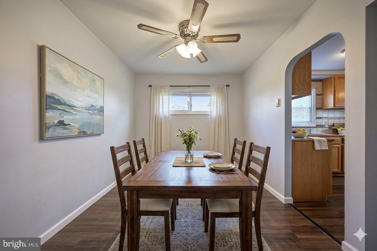 1431 Joshua Clayton Road Dover, DE 19904 - Photo 8 of 31 a view of a dining room with furniture window and wooden floor