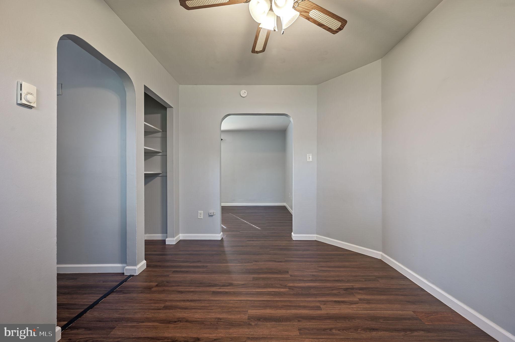 1431 Joshua Clayton Road Dover, DE 19904 - Photo 9 of 31 a view of an empty room with wooden floor