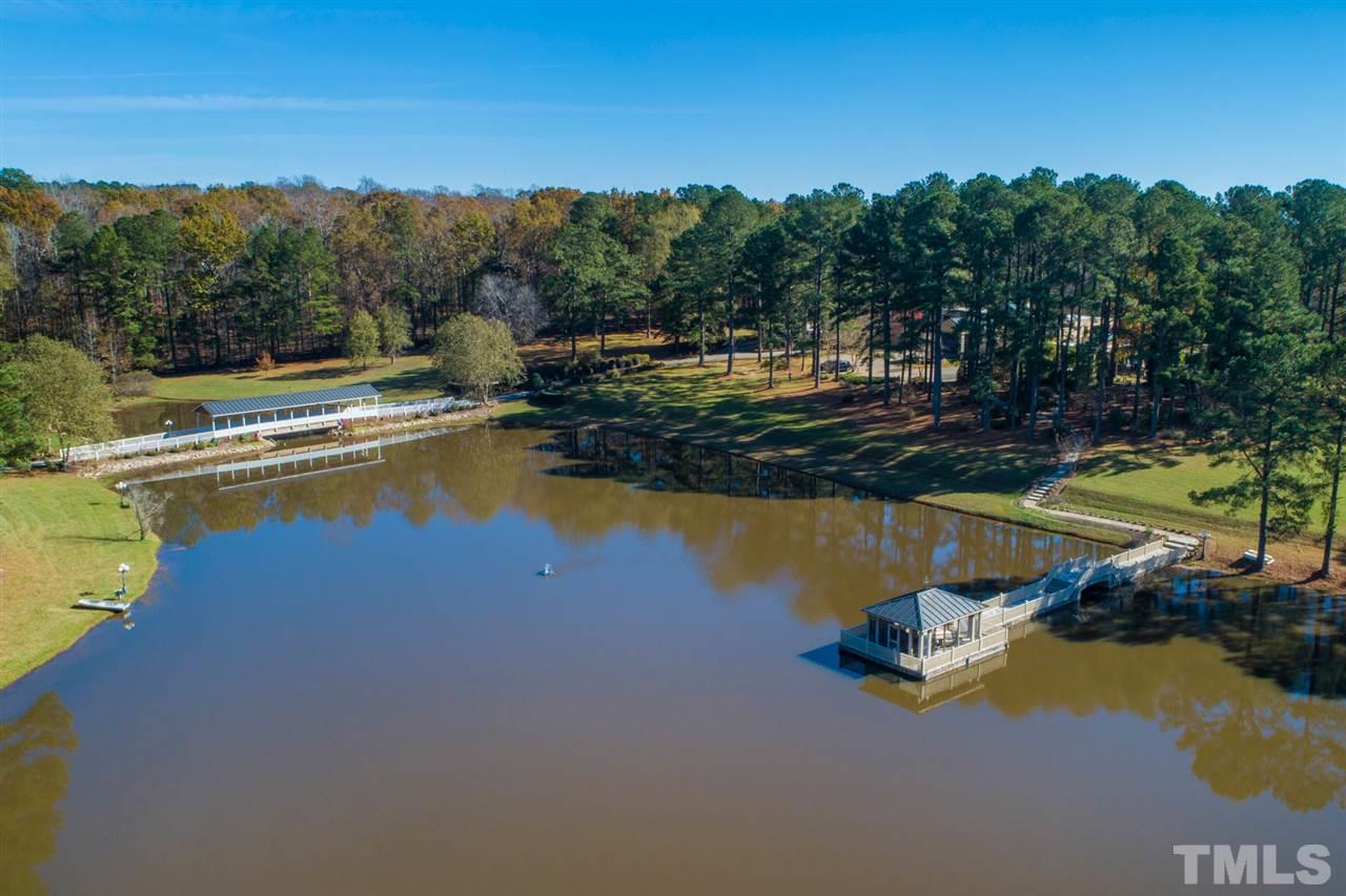 126 Hagwood Road Zebulon, NC 27597 - Photo 1 of 30 a view of a swimming pool with an ocean and trees