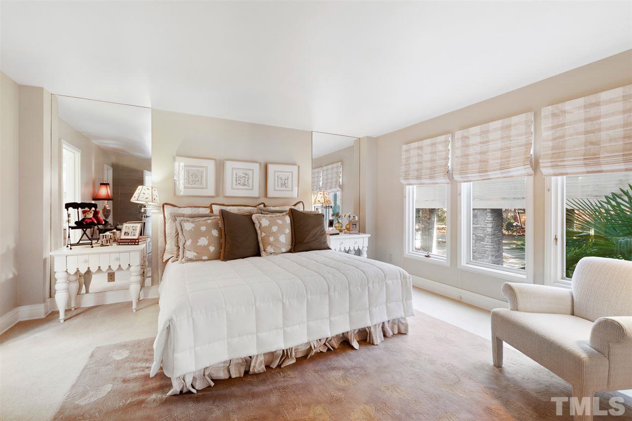 126 Hagwood Road Zebulon, NC 27597 - Photo 21 of 30 a bedroom with a large bed and a large window