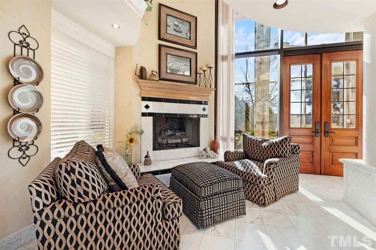 126 Hagwood Road Zebulon, NC 27597 - Photo 22 of 30 a living room with furniture and a fireplace