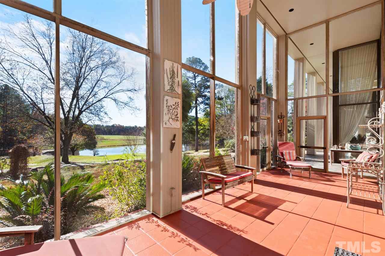126 Hagwood Road Zebulon, NC 27597 - Photo 23 of 30 a building outdoor space with patio furniture and potted plants