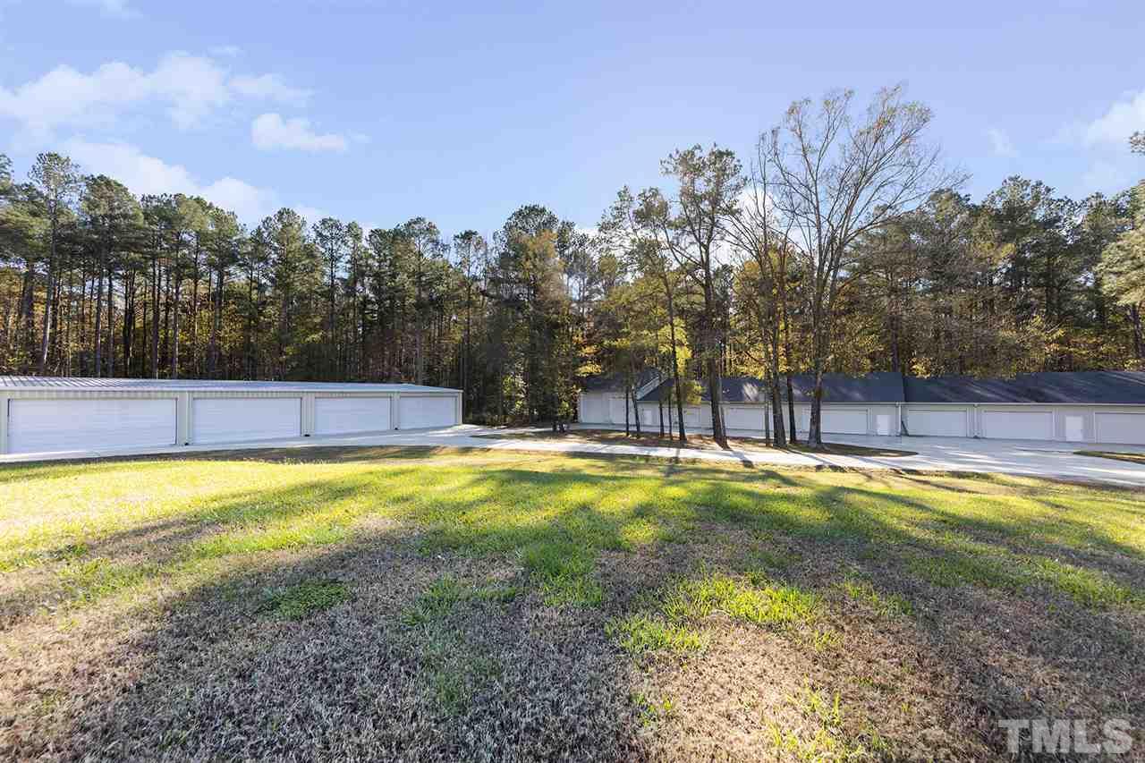 126 Hagwood Road Zebulon, NC 27597 - Photo 28 of 30 a view of a swimming pool with an outdoor space and seating area
