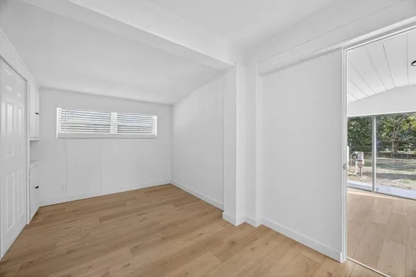 a view of a room that has a window in it
