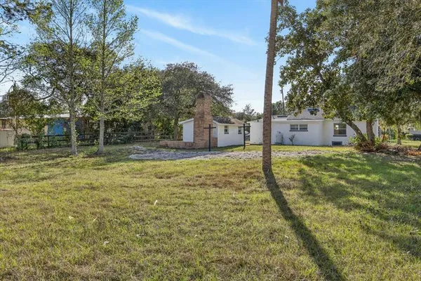 a house view with swimming pool in front of it