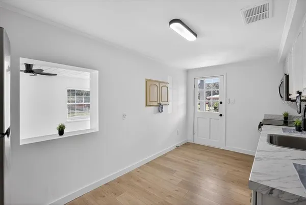 a view of a hardwood floor in a room