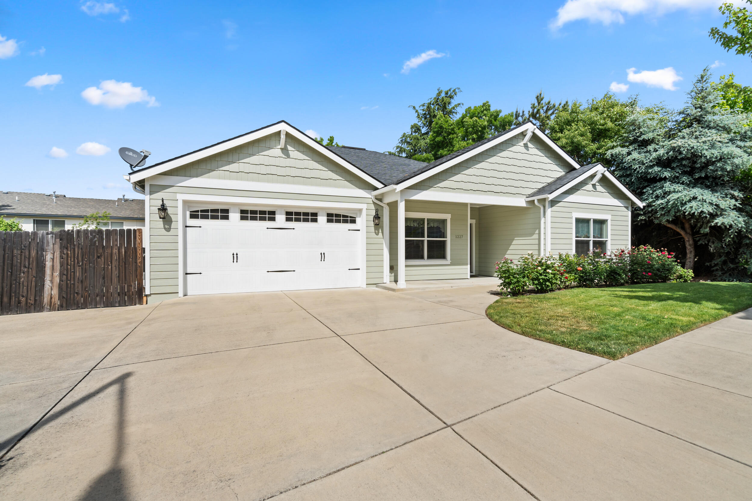 1227 Lithia Way Talent, OR 97540 - Photo 3 of 37 a view of garage and garden