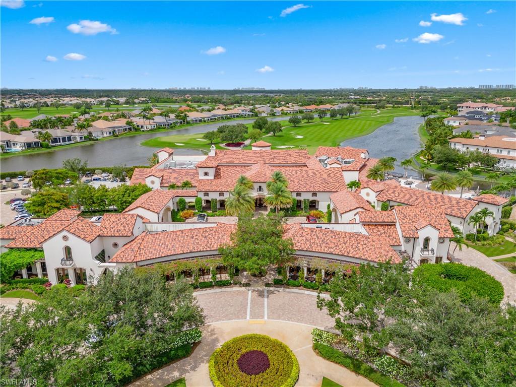 16336 Corsica Way, Unit 201 Naples, FL 34110 - Photo 29 of 34 Aerial view of residential area with a nearby body of water and a golf course