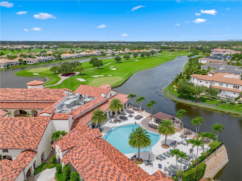 16336 Corsica Way, Unit 201 Naples, FL 34110 - Photo 31 of 34 Aerial view of a golf club and a large body of water