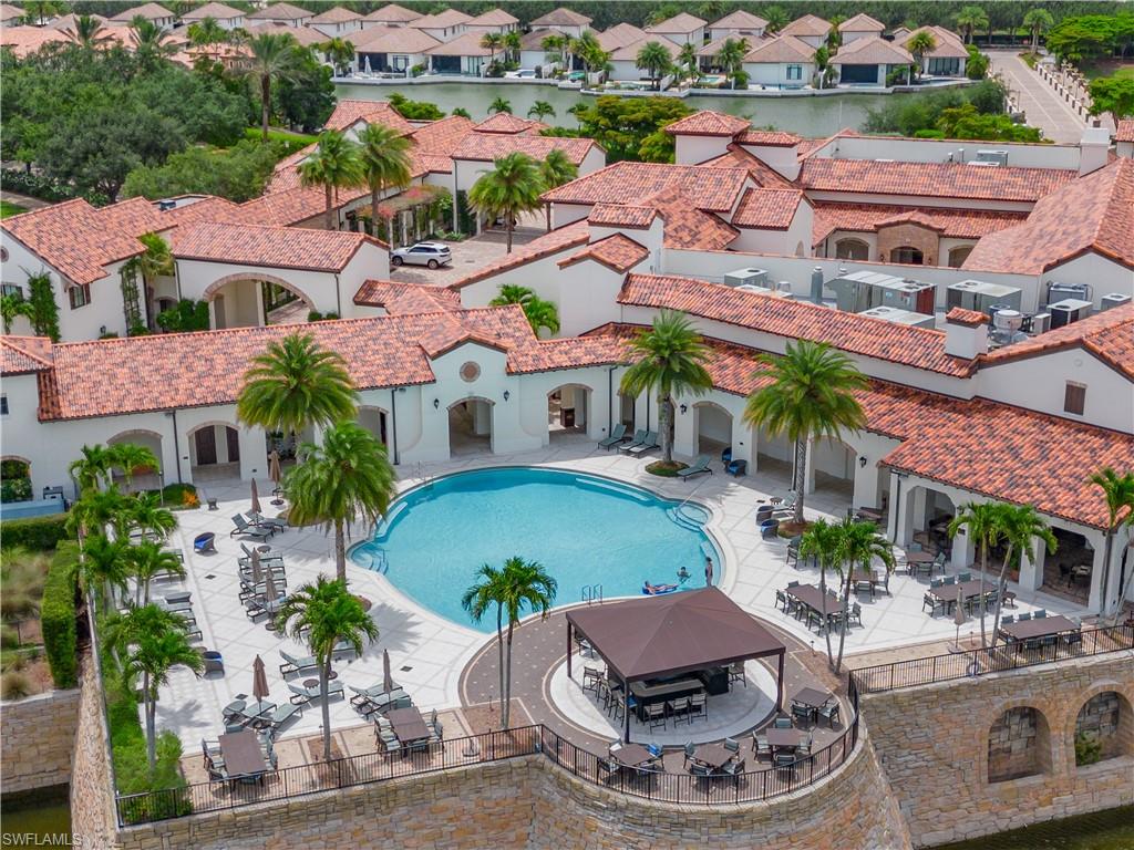 16336 Corsica Way, Unit 201 Naples, FL 34110 - Photo 32 of 34 Community pool with a patio area