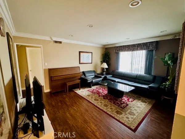 a living room with furniture and a rug