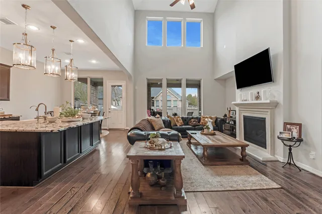 a living room with fireplace furniture and a flat screen tv
