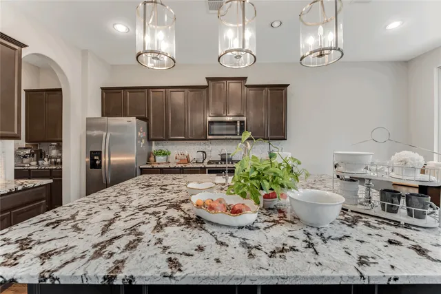 a kitchen with a table and chairs in it