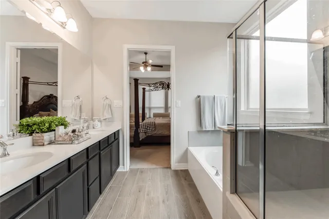 a bathroom with a double vanity sink and mirror