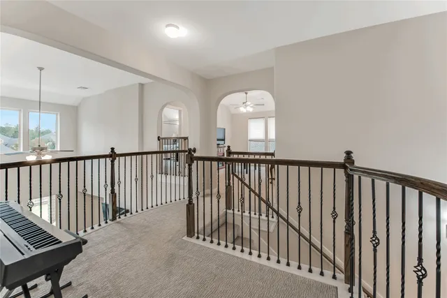 a view of a hallway view with staircase