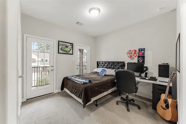 a bedroom with bed and a window