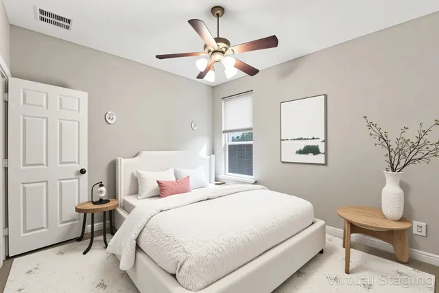 a bedroom with a bed and a window